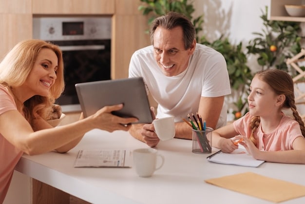 A family sitting at a table, reviewing health insurance documents and smiling. Soft, natural light coming through the window.