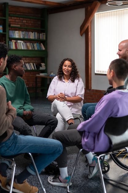 A diverse group of people participating in a group therapy session led by a therapist. The setting is warm and inviting, fostering a sense of community and support.