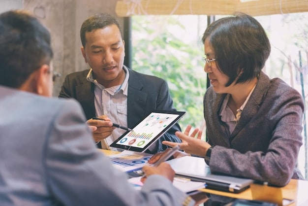A person reviewing HSA plan options on a tablet during a meeting with a financial advisor. The scene conveys a sense of professional guidance and detailed planning.