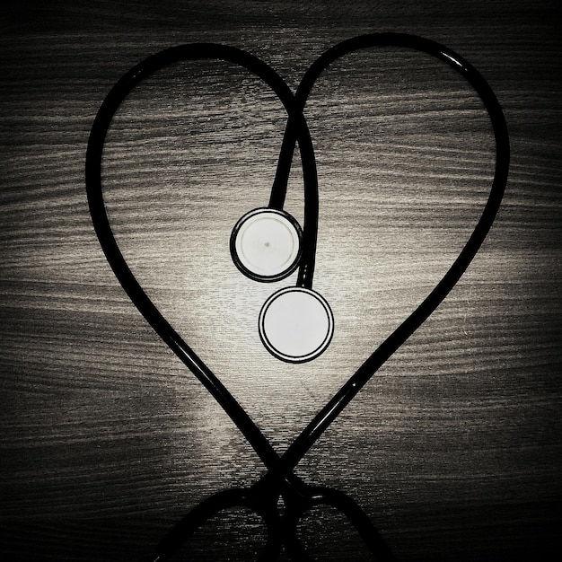 A split image showing a wedding ring and a stethoscope, symbolizing the dual roles of marriage and healthcare that intersect in HSA beneficiary planning. The background is a warm, inviting home setting.