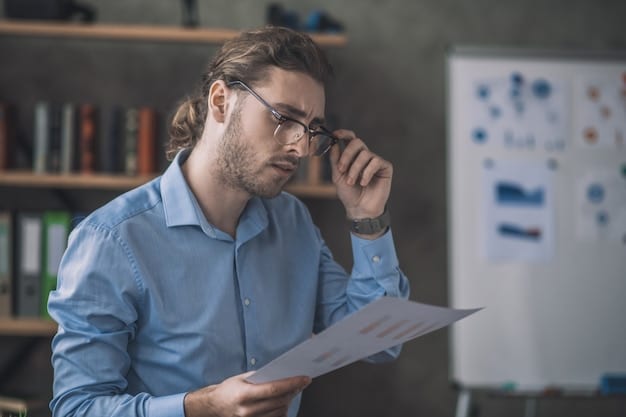 A person looking concerned while reviewing financial documents, illustrating the importance of accurate income reporting for tax credits. The lighting should be soft, creating an atmosphere of seriousness.