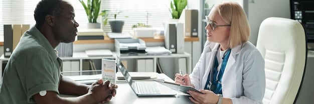A healthcare professional explaining different insurance plan options to a patient in an office setting.