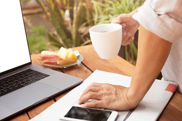 A person reviewing documents related to their Health Savings Account (HSA) on a laptop, with a pen, notepad, and coffee cup on the desk.
