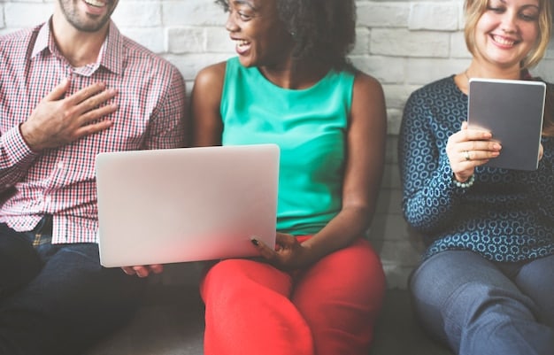 A laptop screen showing the Health Insurance Marketplace website, with a diverse group of people visible in the background, representing the broad range of individuals who can benefit from the Marketplace.