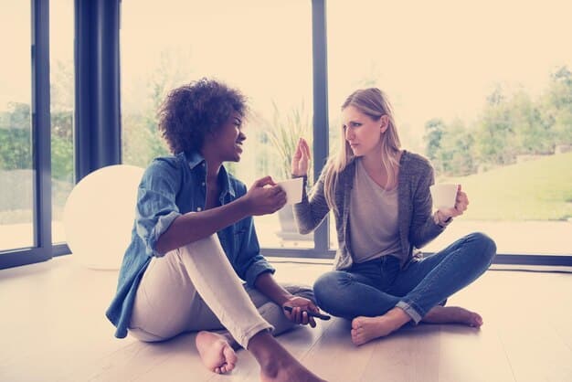 Two individuals communicating, one with a calm and open stance, the other initially tense but starting to relax, indicating a positive shift in their difficult conversation.
