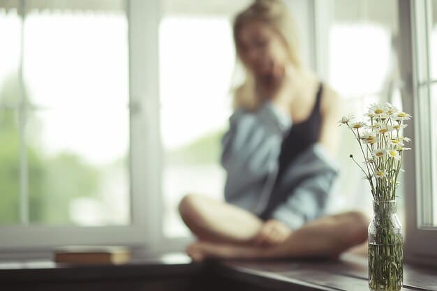 A serene person practicing gentle, mindful stretches in a modern, uncluttered office space, with soft lighting and a blurred background, suggesting internal calm amidst a professional environment.