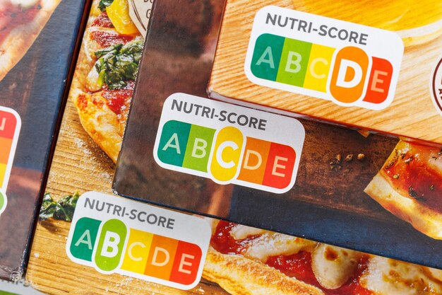 A detailed close-up of a food label specifically highlighting the allergen information section, with bold text and clear icons for common allergens like nuts and dairy, on a white background.