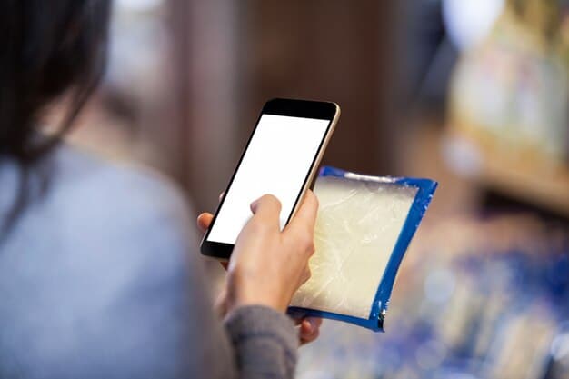 A hand holding a smartphone, scanning a QR code on a food product label in a supermarket aisle, with a soft focus on the digital information appearing on the phone screen.
