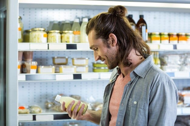 A calm person reading a food label in a grocery store, focusing on the 