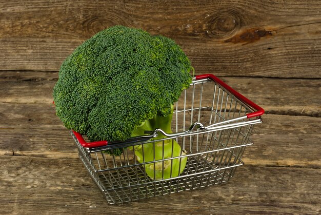 A close-up shot of a healthy and diverse shopping cart filled with fresh produce (leafy greens, colorful bell peppers, berries), lean proteins (chicken breast, salmon), and whole grains (quinoa, brown rice), ready for meal prepping.