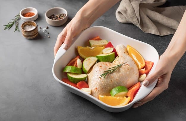 A person's hands meticulously arranging prepped ingredients—chopped vegetables, cooked chicken, and brown rice—into meal prep containers, demonstrating efficient batch cooking.