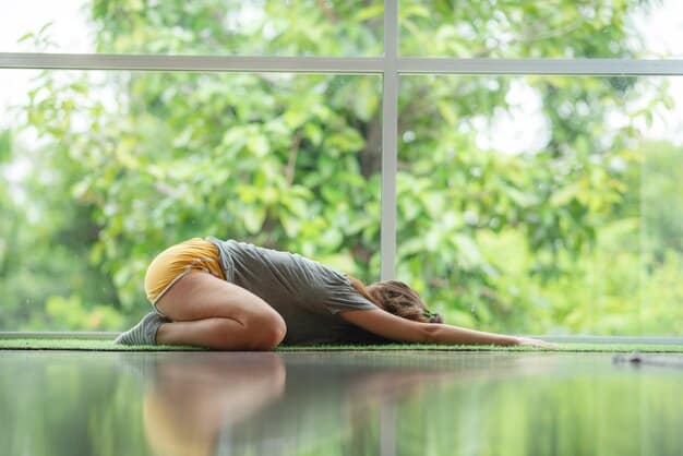 A person in a serene yoga pose, eyes closed, on a mat in a peaceful natural setting, embodying mindfulness and relaxation.
