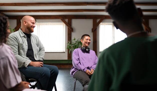 A diverse group of people participating in a support group session, seated in a circle, some talking, others listening empathetically. The atmosphere is open and supportive.