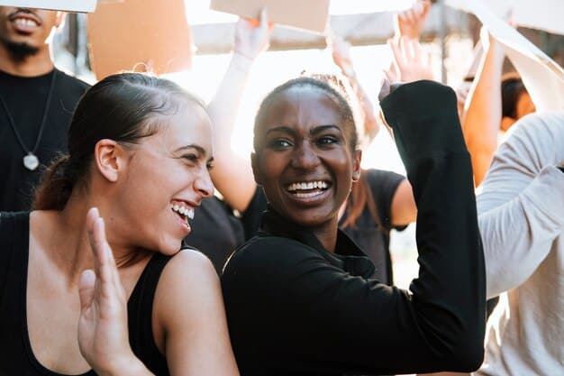 A group of diverse people cheering and high-fiving in a bright, collaborative environment, symbolizing supportive networks and shared success. Their expressions are joyful and encouraging.