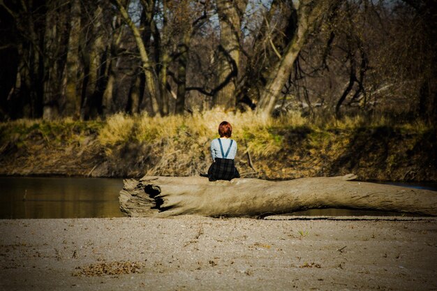 A person meditating calmly in a serene natural setting, symbolizing inner peace and resilience through mindfulness.
