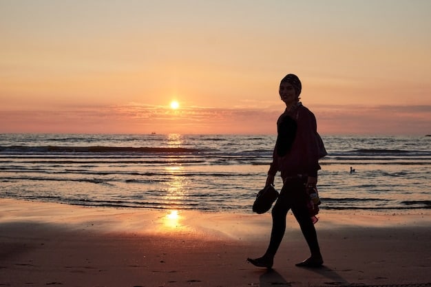 A person's silhouette walking into a sunset on a beach, representing peace and tranquility. This visual reinforces the message of mindful walking enhancing overall well-being, complementing the study results indicating that 'Alert: New Research Shows Mindful Walking Reduces Stress Levels by 18% in Adults Over 40'.