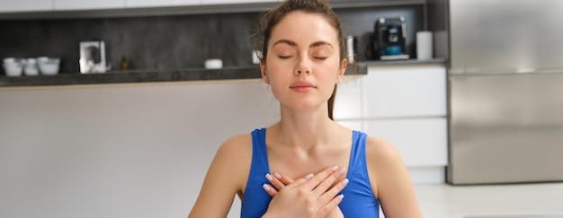 A close-up of a person's chest rising and falling gently as they practice deep breathing. The lighting is soft, and the focus is on the gentle movement of the breath. This image supports