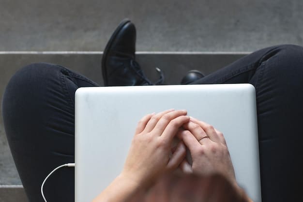 A close-up shot of someone's hands gently resting on their lap, with fingers interlaced, while they are meditating during their lunch break at work. The image conveys Time-Sensitive: The Best Time of Day to Practice Mindfulness for Optimal Results in 2025 to promote relaxation and productivity amid a busy workday.