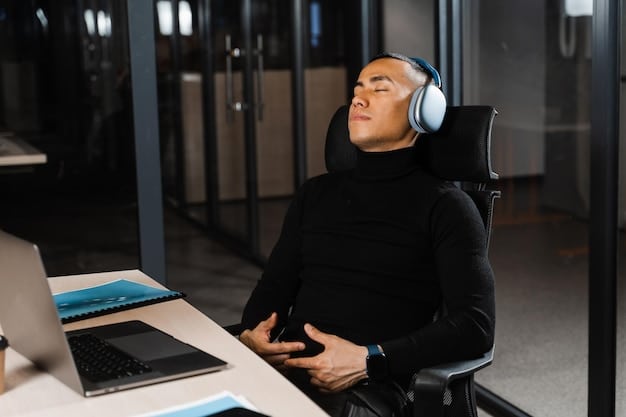 A person sits in a quiet office space mediating with noise cancelling headphones on, eyes closed, taking deep breaths, embodying self-awareness and emotional control as part of Practical Solutions: A Step-by-Step Guide to Mindful Communication in the Workplace.