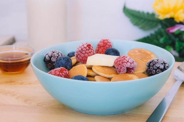A close-up shot of a healthy snack mix in a bowl, featuring a colorful assortment of almonds, blueberries, and small whole-grain crackers, emphasizing nutritional balance.