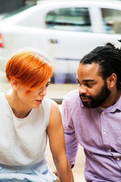 A close-up shot of two people making direct eye contact during a conversation, emphasizing active listening and engagement. The lighting is soft, focusing on their faces and expressions, illustrating The Art of Effective Communication: Improve Your Relationships and Achieve Your Goals.